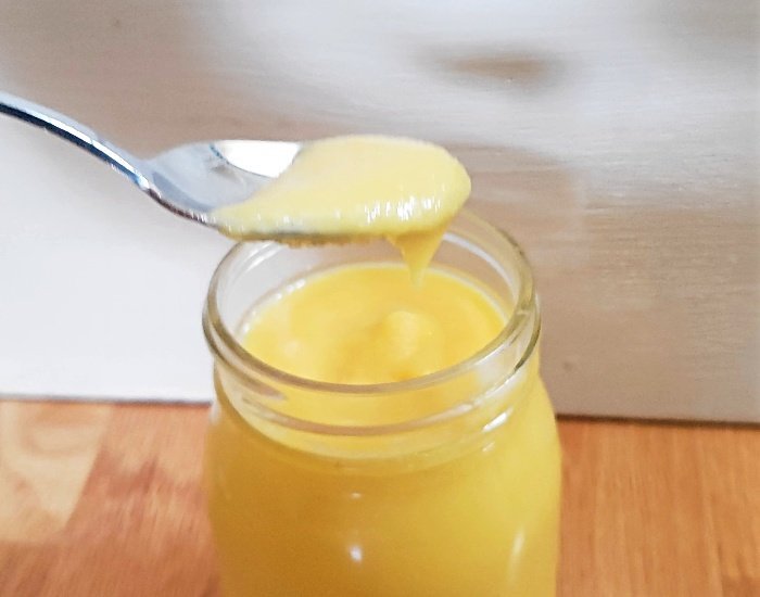 Spoon of mango curd