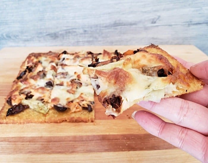 Slice of Mediterranean pizza