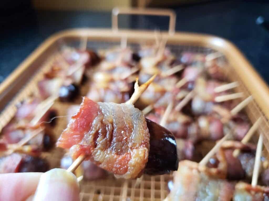 Image shows Bacon wrapped in dates.