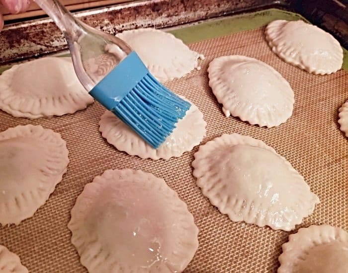 Brush tops with egg white