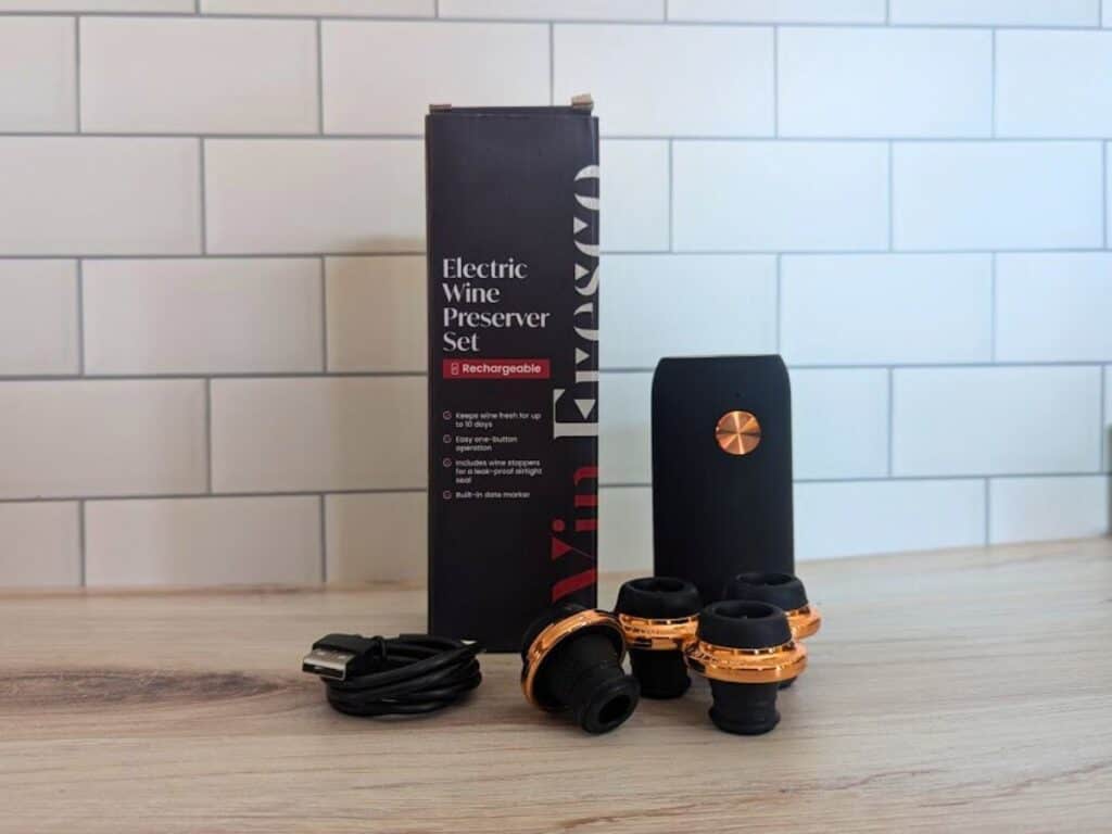 Image shows the Vin Fresco electric wine preserver kit sitting on a wooden table.