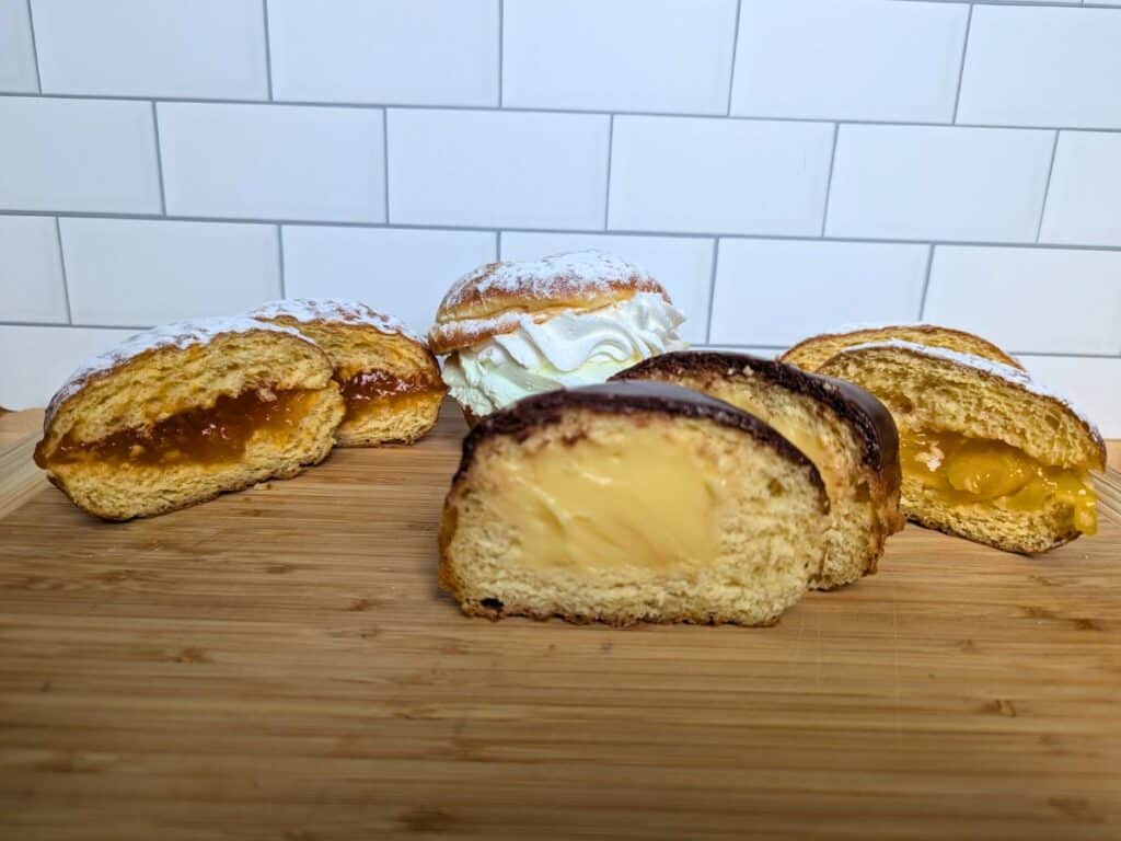 Image shows four paczki flavors from Sweet Ts Bakery in Arlington Heights.