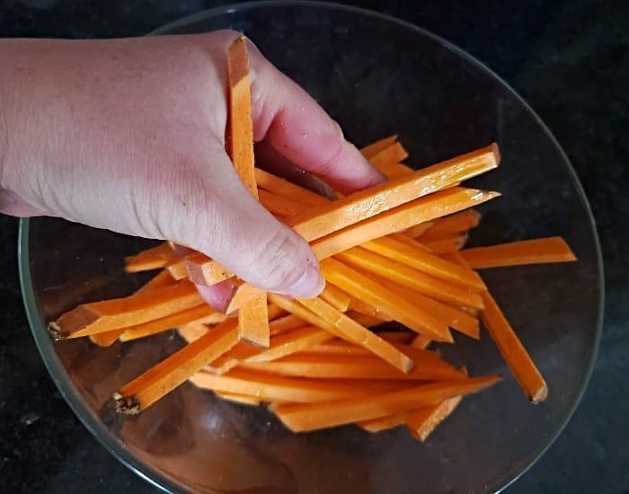 Toss sweet potatoes with olive oil