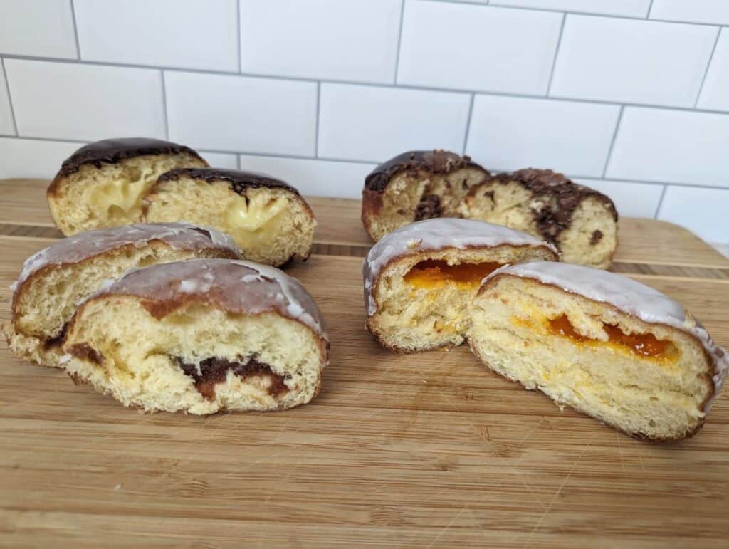 four paczki cut in half from Hanna's Bakery and Cafe.