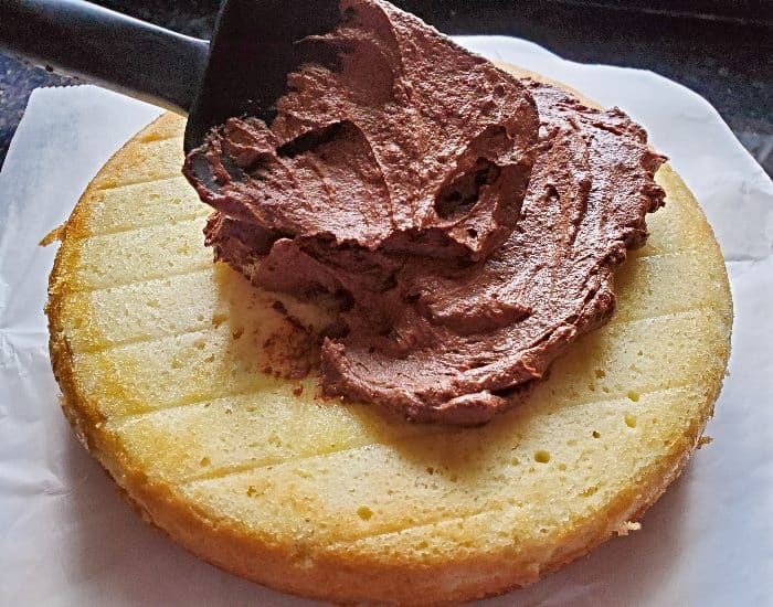 Smooth ganache onto cake layer