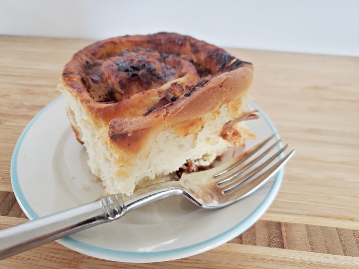 Amazing bbq pulled pork cinnamon roll on a plate