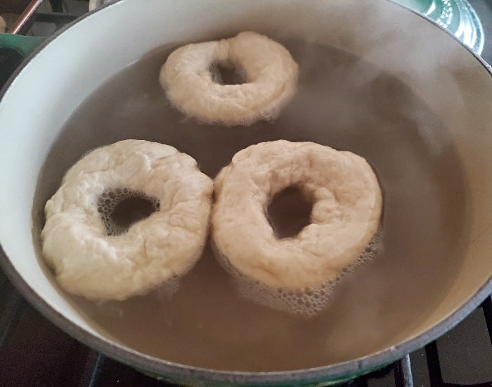 Bagels simmering to start cooking
