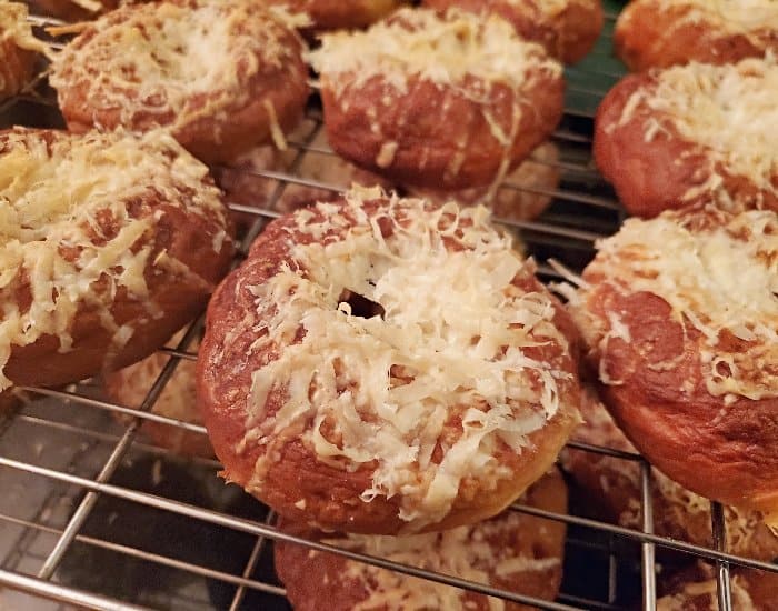 Cool asiago bagels on a wire rack