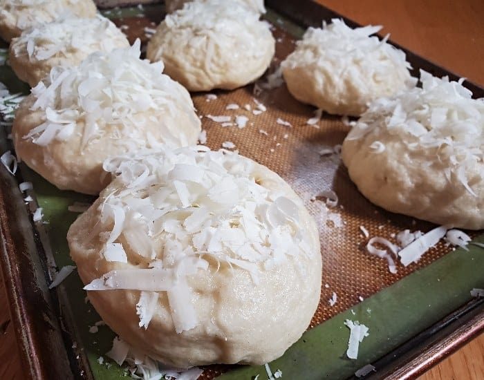 Shredded cheese added to bagels