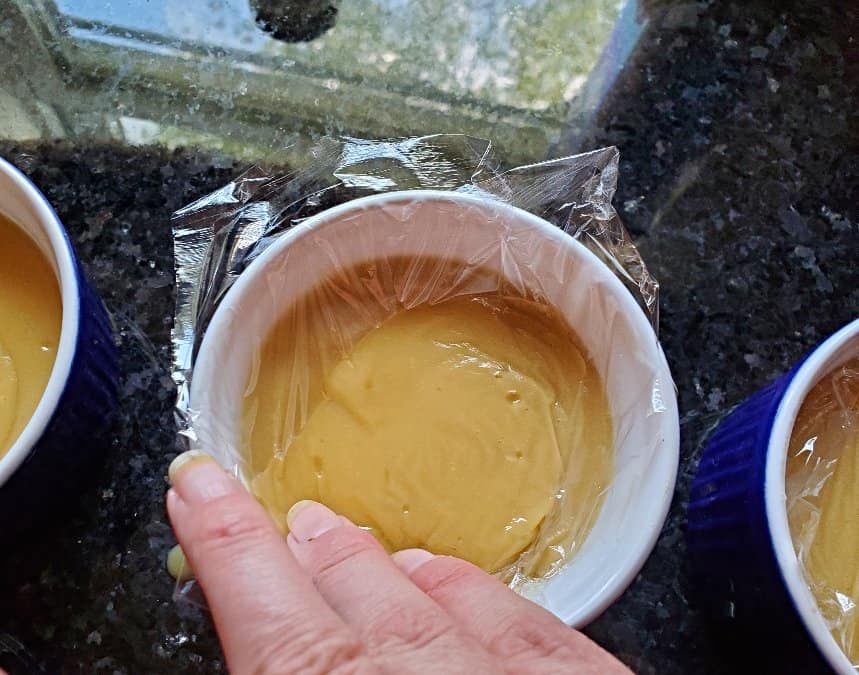 Add plastic wrap to the top of warm pudding