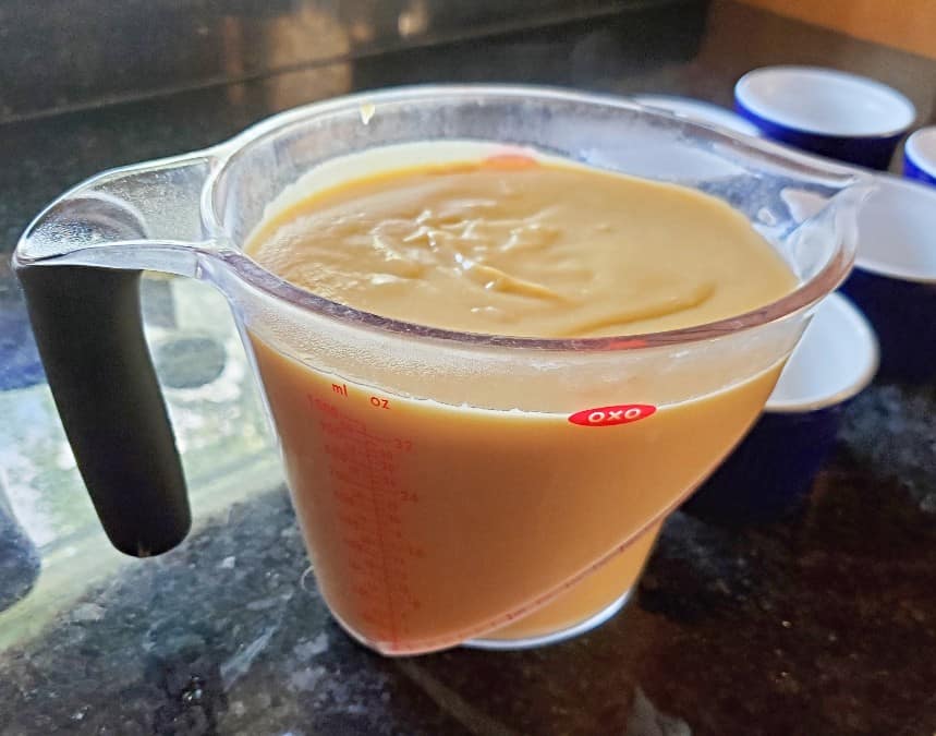 Butterscotch pudding in a measuring cup to easily pour it
