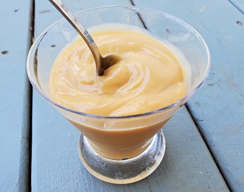 Spoon in homemade butterscotch pudding