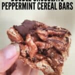 Holding a single dark chocolate peppermint cereal bar