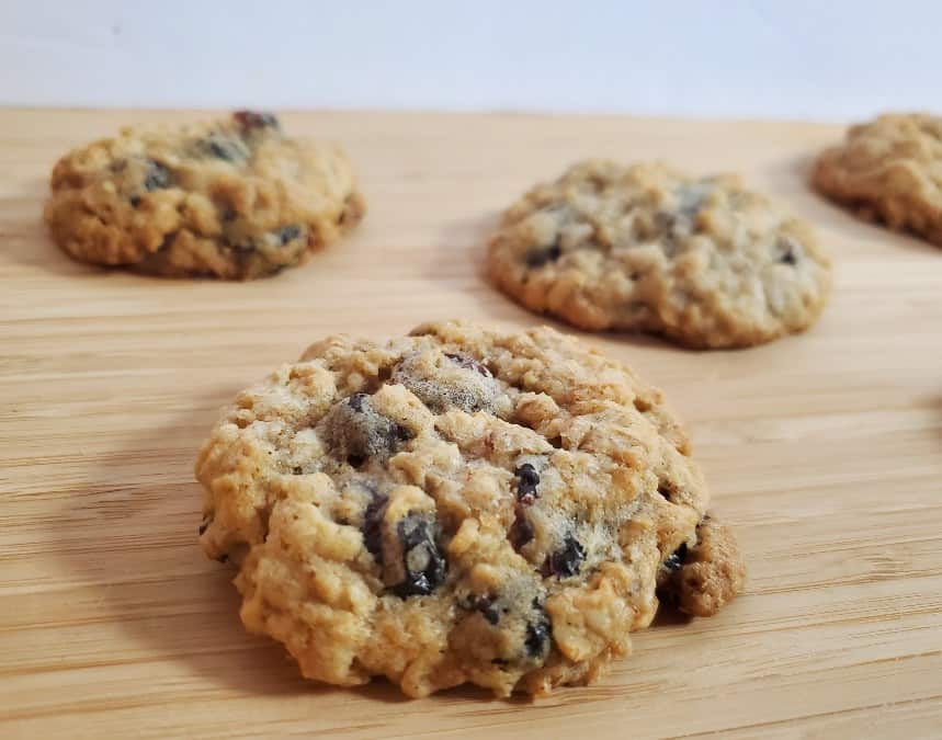 Close up of oatmeal cranberry cookies on a wooden platter