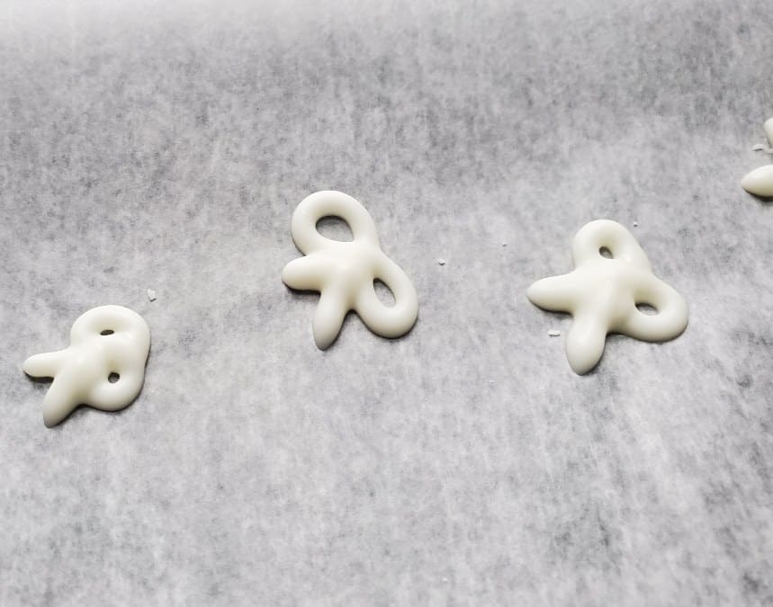 White Chocolate bows on wax paper