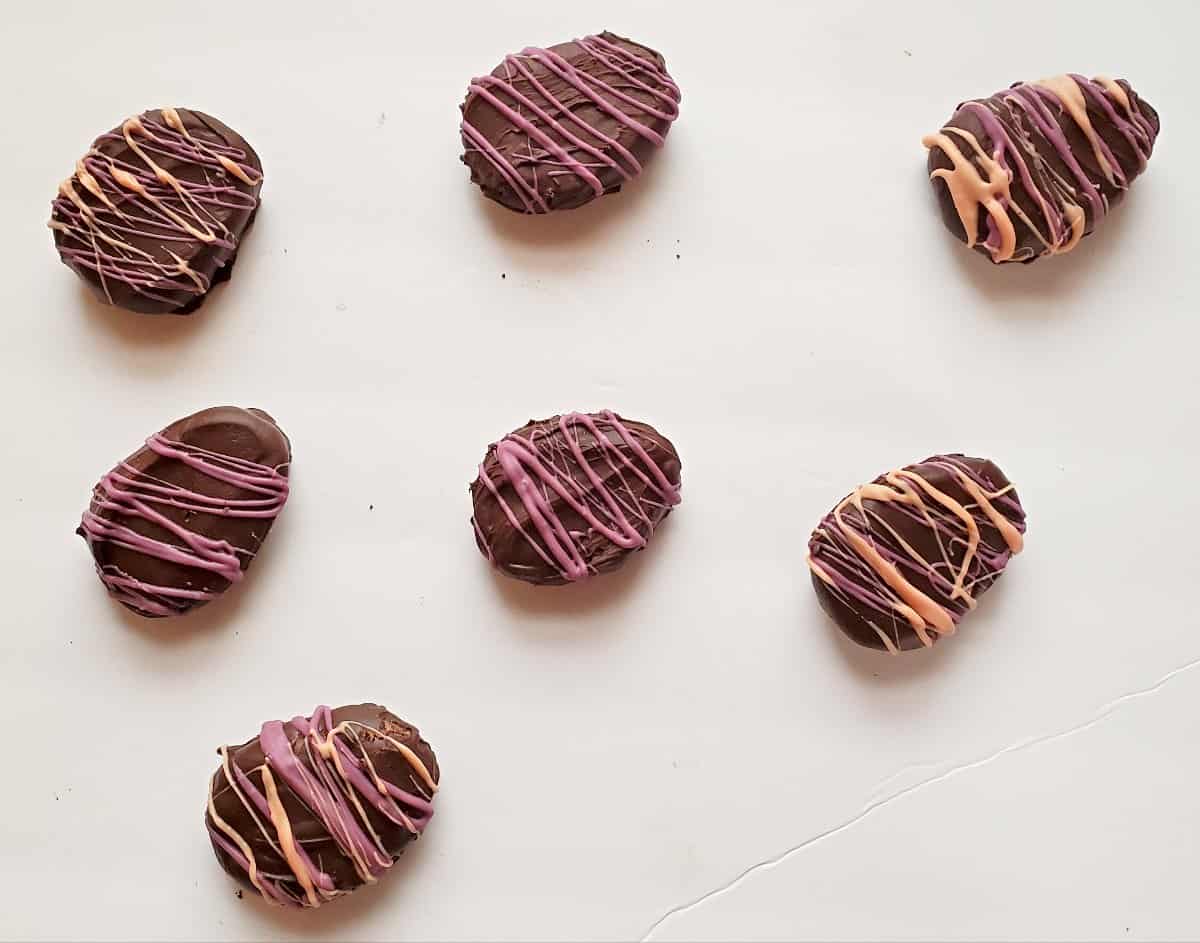 Cookie dough easter egg truffles on a white background.
