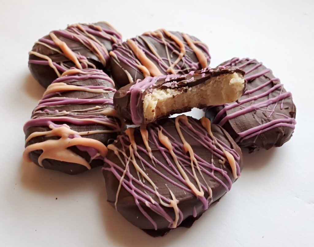 cookie dough easter egg truffles with one bite taken.