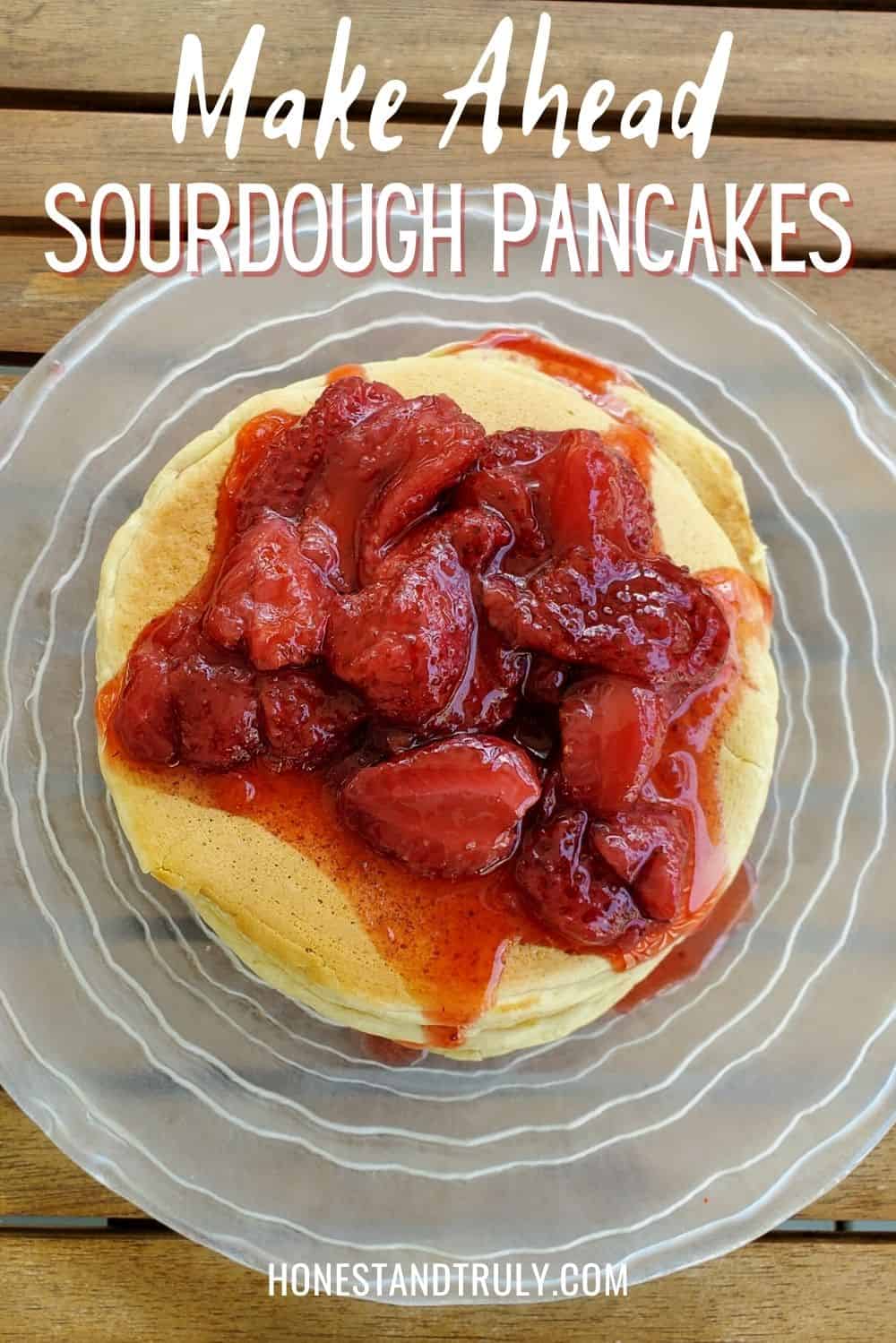 Overhead closeup of pancakes with strawberry syrup