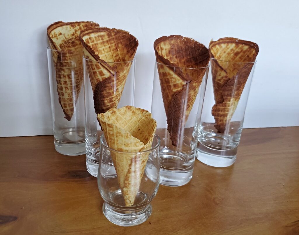 Waffle cones cooling sitting in glasses