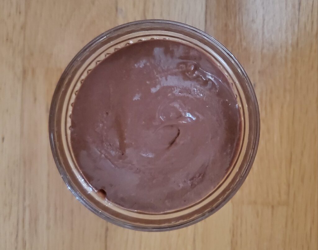 Overhead shot of chocolate mousse in a dish.