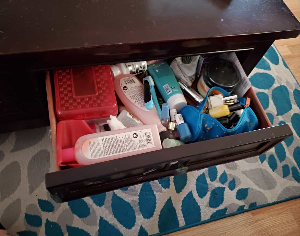 Coffee table drawer full of junk.