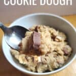 Closeup of a spoon of edible candy bar cookie dough with text edible raw cookie dough.