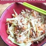 Closeup overhead of a bowl with egg roll ingredients and text simple and easy deconstructed egg roll.