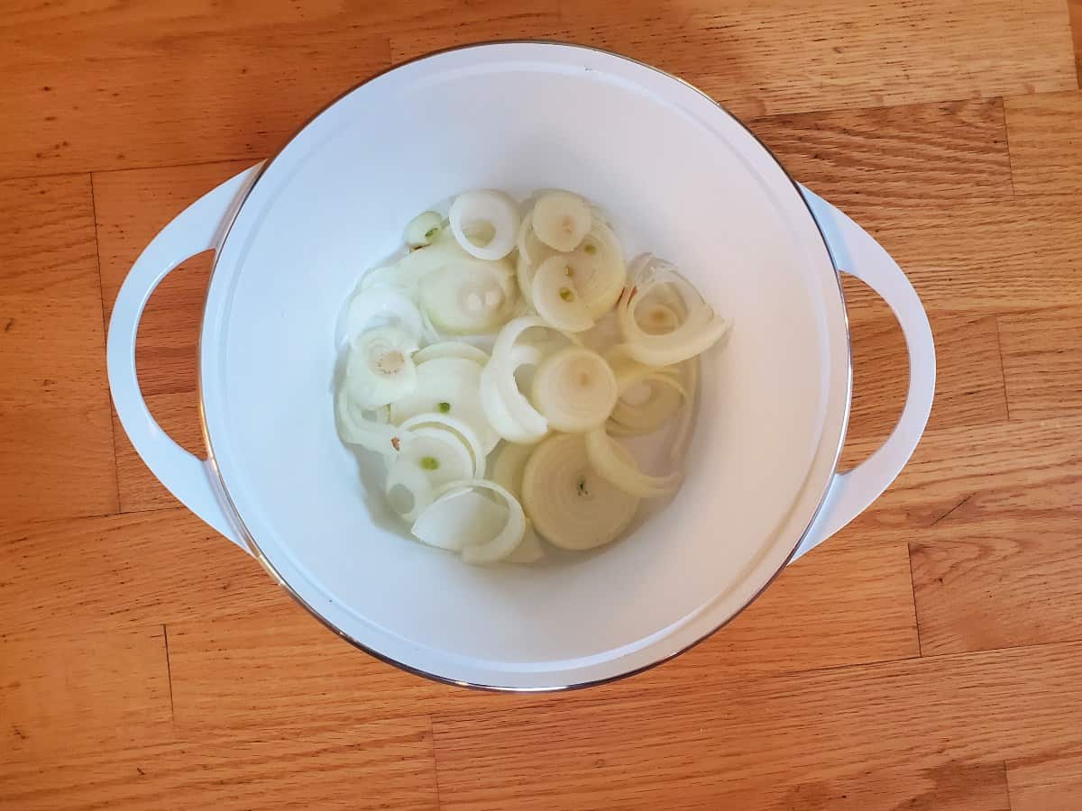 Layer onions in the bottom of dutch oven.