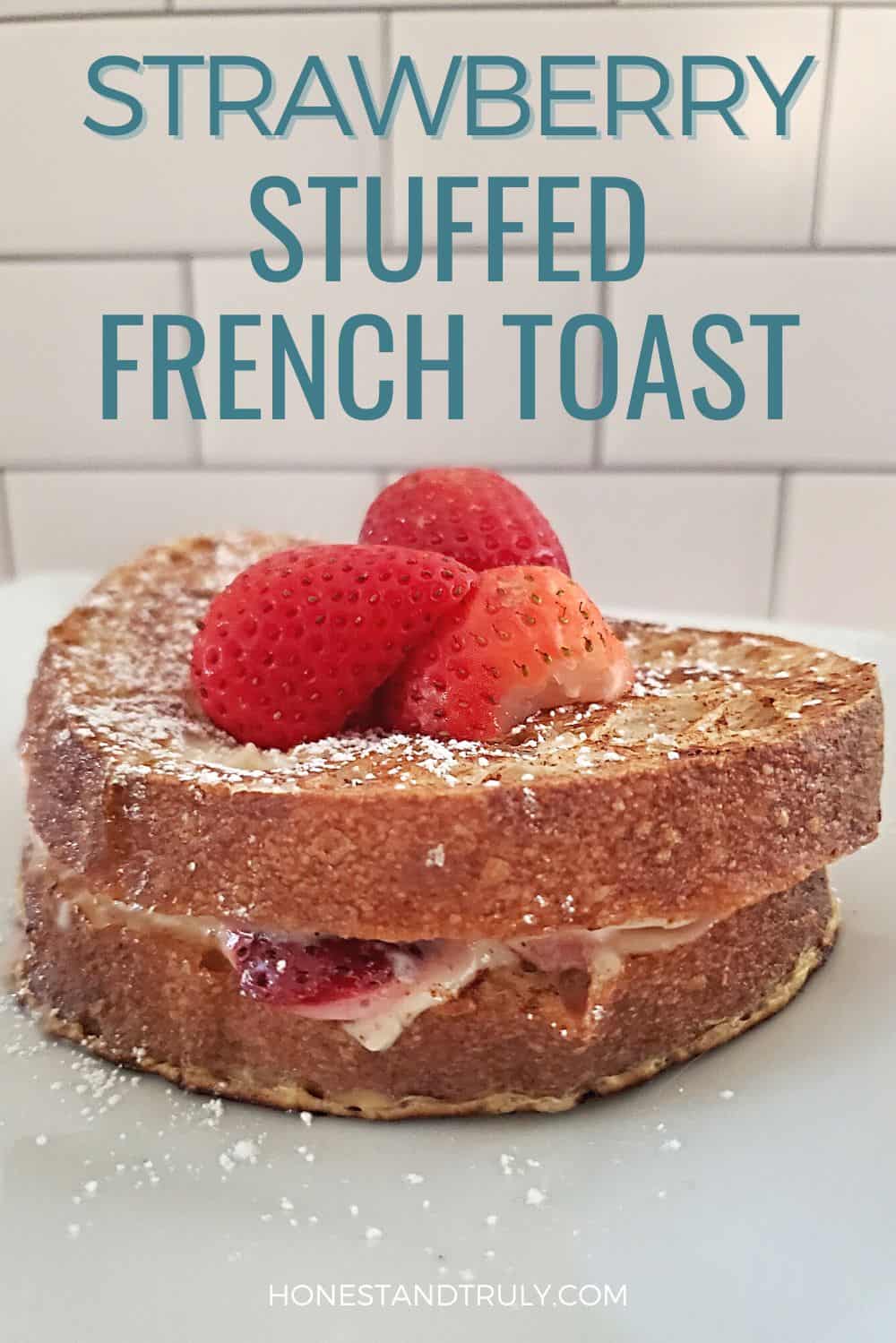 Stuffed french toast topping with strawberries and text Strawberry stuffed french toast.