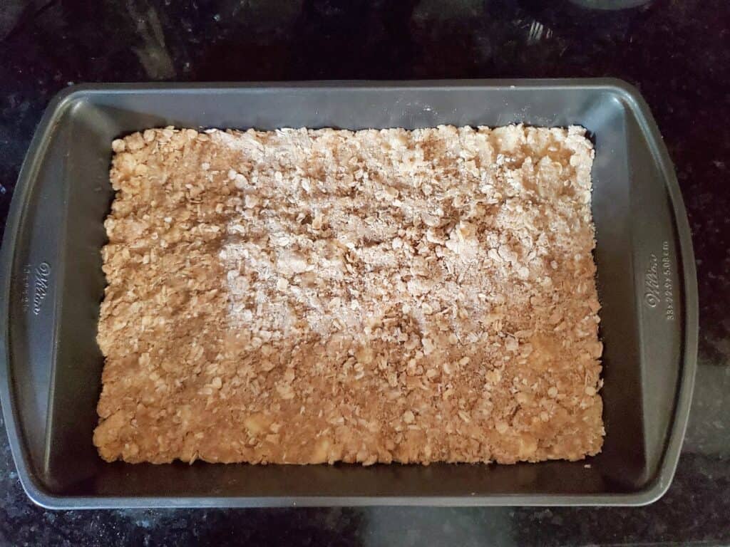 Overhead shot of crumb base in a 9x13 pan.