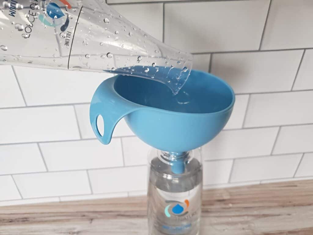 Add Force of Nature to spray bottle with funnel.
