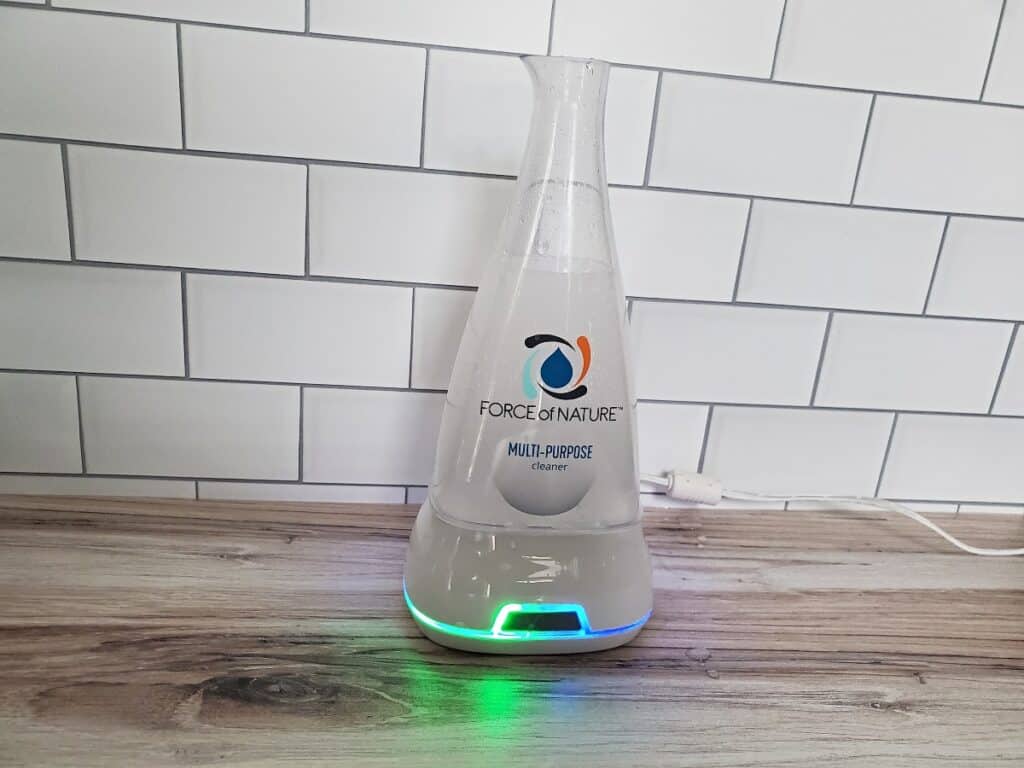 Force of Nature activating in its bottle with the base glowing blue and green.
