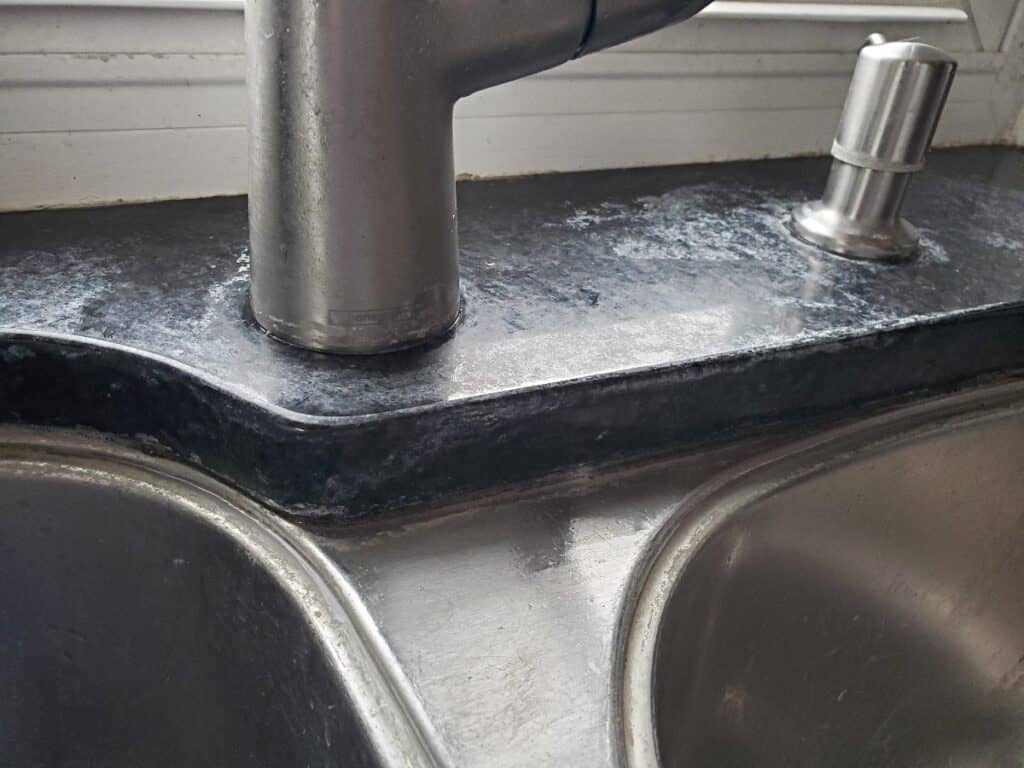 Hard water stains removed from kitchen sink.