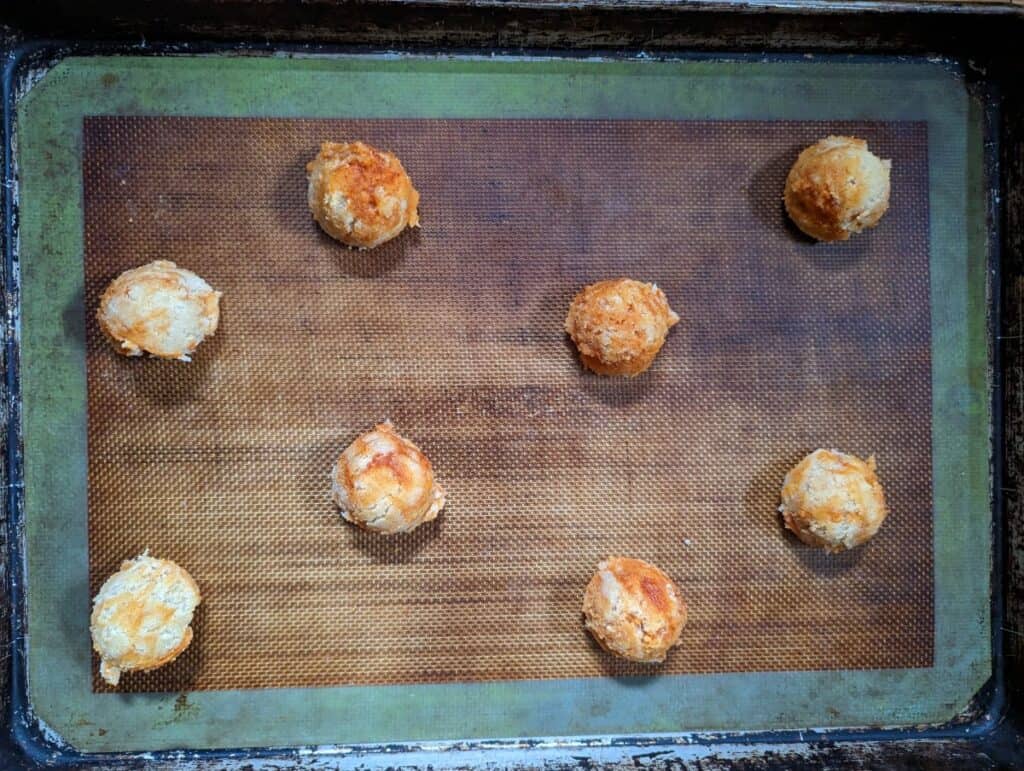 Cookie sheet with unbaked spicy caramel cookies on it.