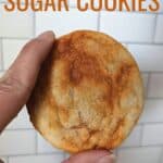 Hand holding a unique sugar cookie with text spicy caramel sugar cookies.