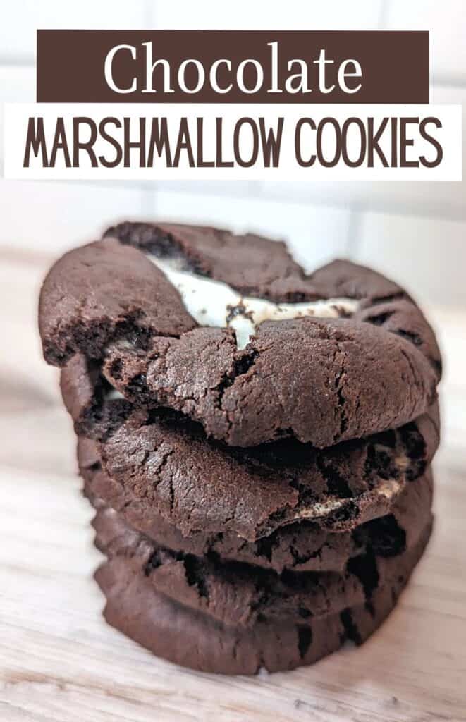 Stack of chocolate marshmallow cookies on a wooden board with subway tile backsplash with text Chocolate Marshmallow Cookies.