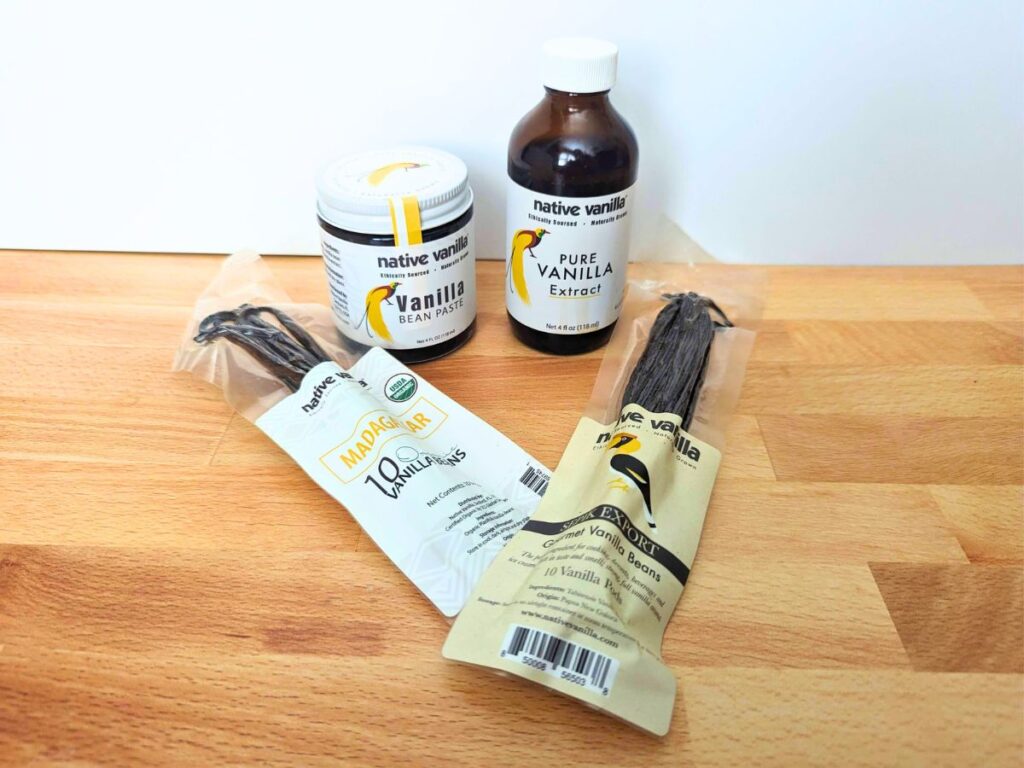 Image shows Native Vanilla products on a wooden table.