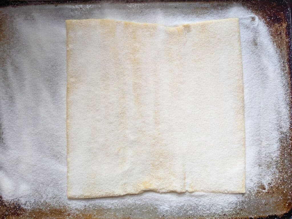 Image shows an Overhead of phyllo dough coated with sugar.