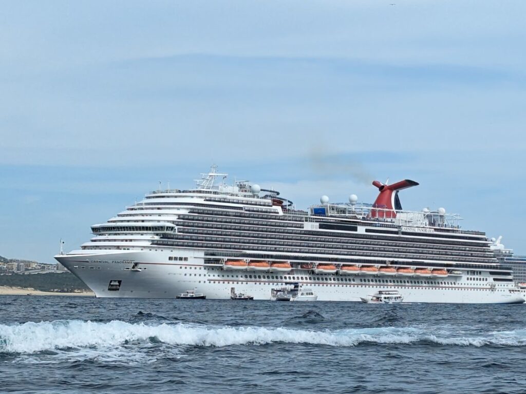 Image shows Carnival Panorama docked in port.