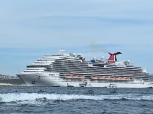 Image shows Carnival Panorama docked in port.