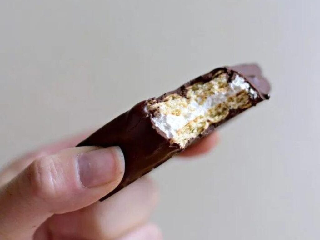 Image shows a bite of homemade smore's cookies.