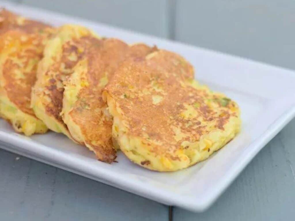 Image shows delicious gluten free corn fritters.
