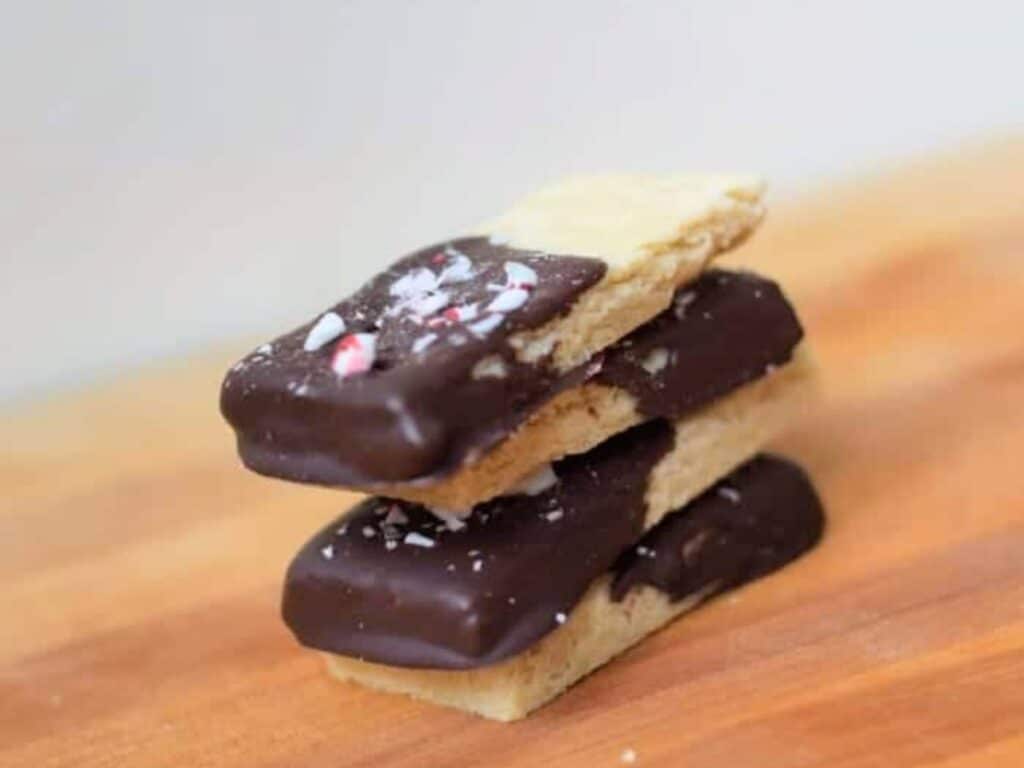 Image shows delicious peppermint shortbread cookies stacked together.