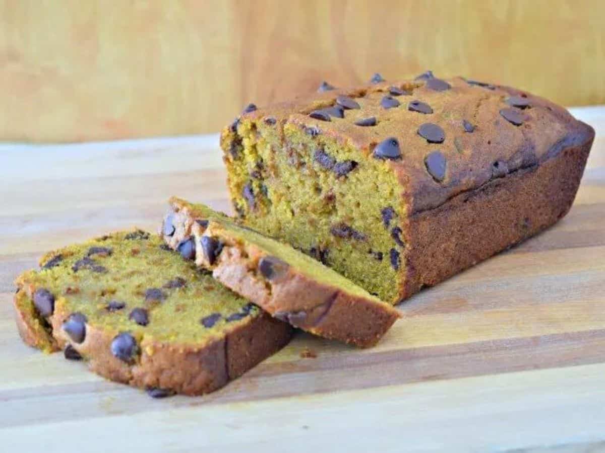 Chocolate Chip Pumpkin Bread sliced on a cutting board.