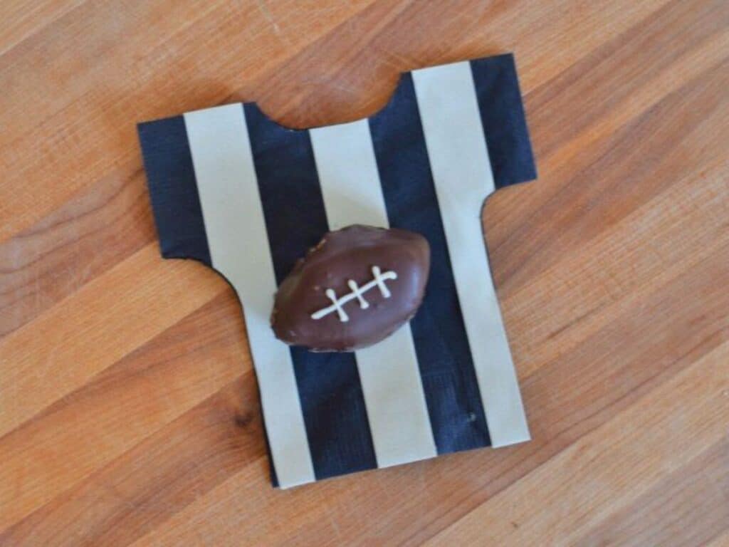 Image shows easy to make football Oreo cookie ball.