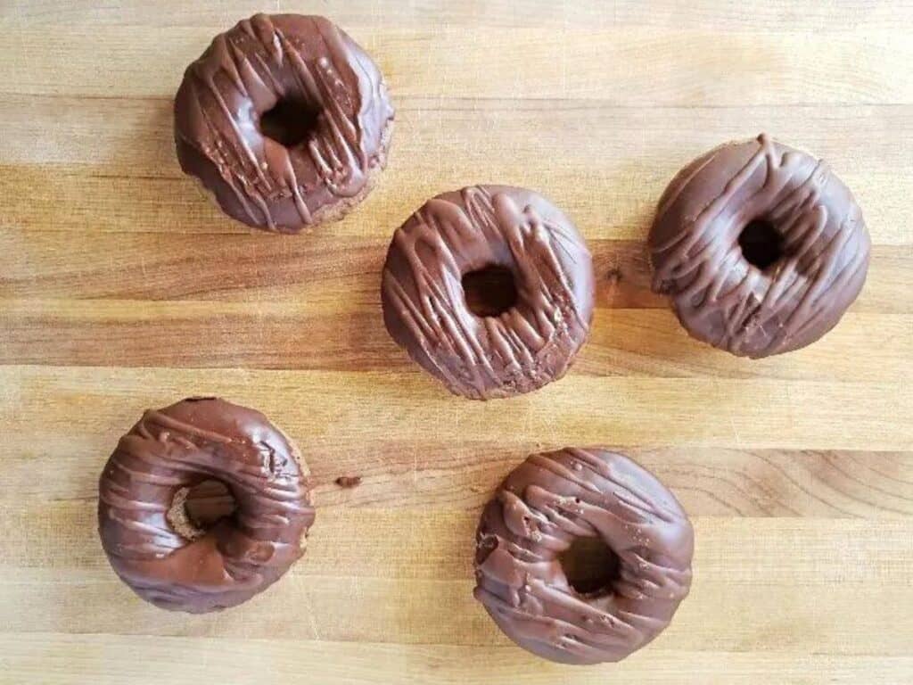 Image shows group of delicious mocha donuts.