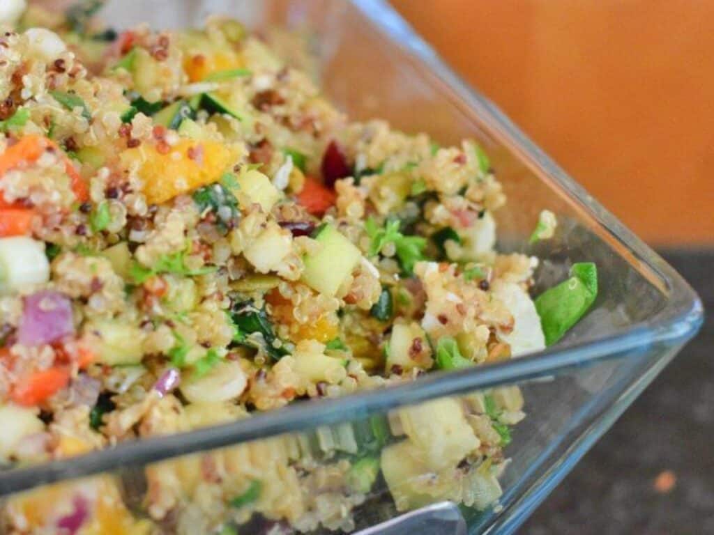 Image shows harvest quinoa salad in a food container.