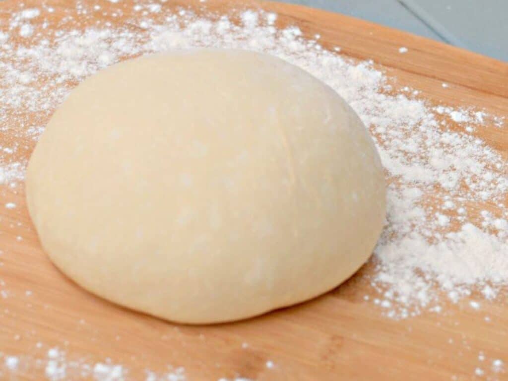 Image shows homemade pizza dough recipe.