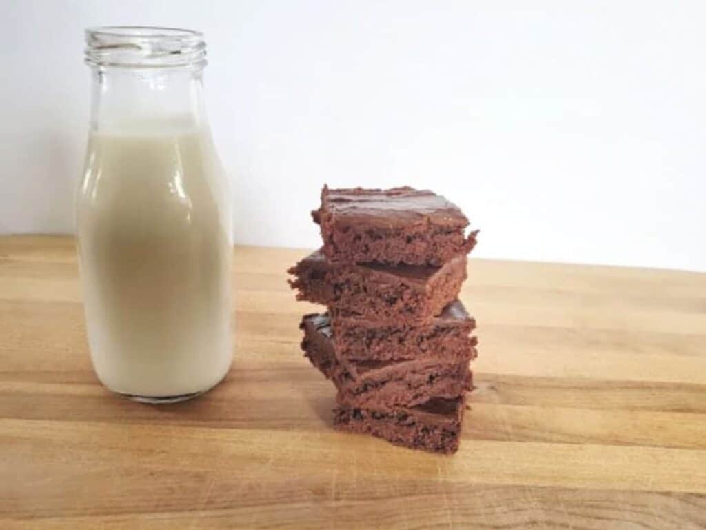 Image shows irresistible Texas sheetcake brownie stacked.