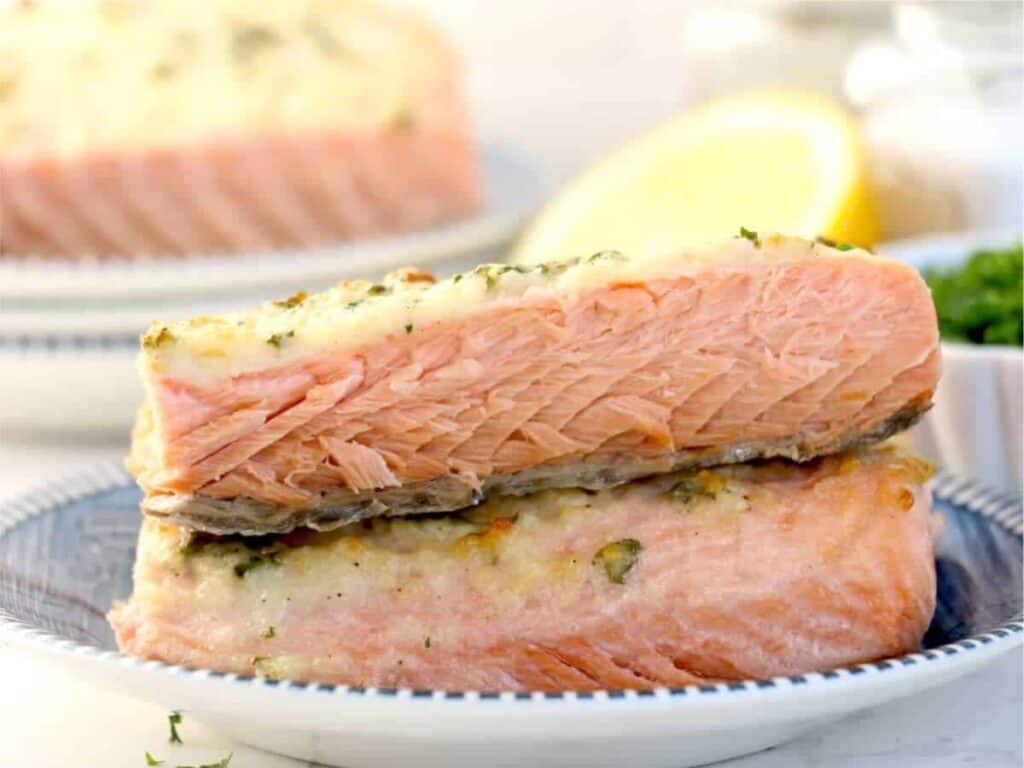 Image shows irresistible baked salmon with mayo.